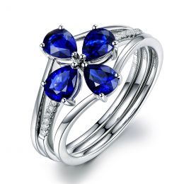 Bague solitaire saphirs fleur et Or blanc. Linéaire diamants