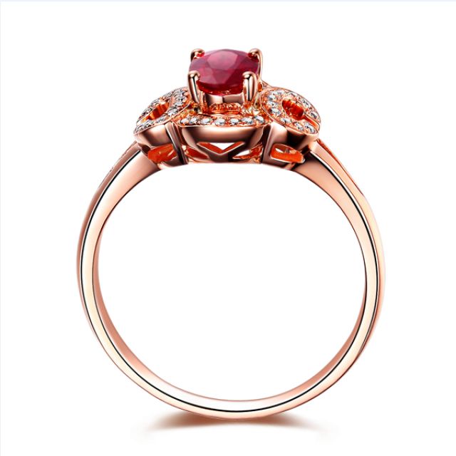 Bague de fiançailles en rubis diamants et or rose. Motifs bouclés