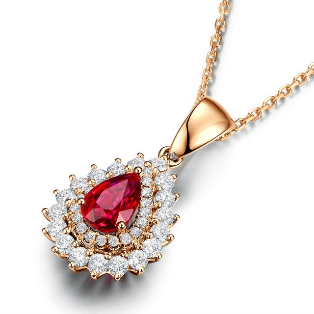 Pendentif rubis rouge vif taillé poire. Diamants sertis et Or rose