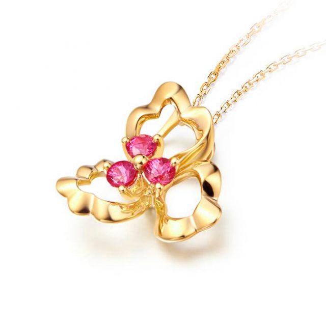 Pendentif fleur à 3 Pétales. Or jaune 18 carats. Rubis