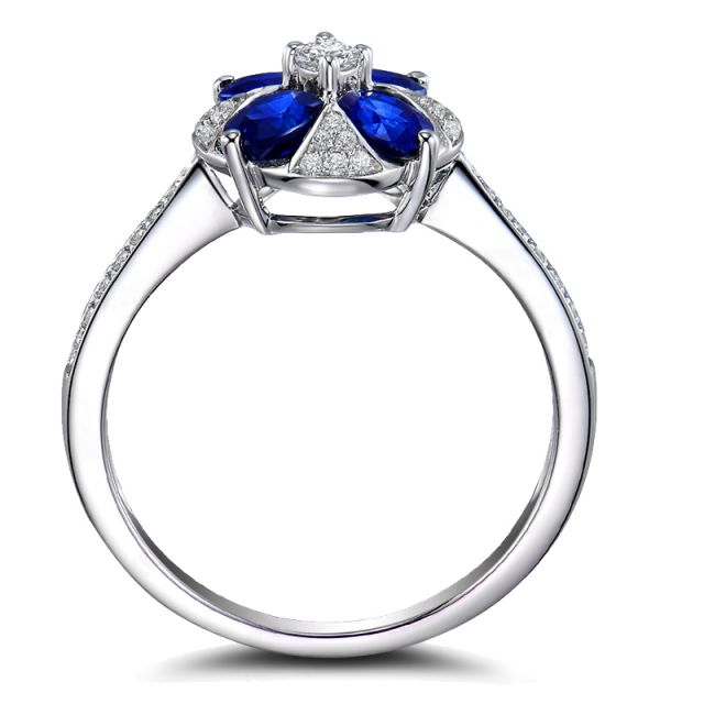 Bague solitaire fleur bleue. Or blanc, saphirs et diamants