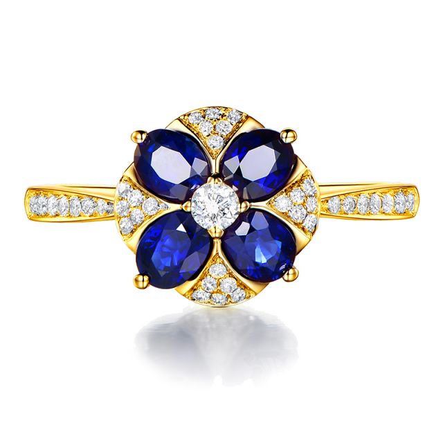 Bague solitaire fleur bleue. Or jaune, saphirs et diamants