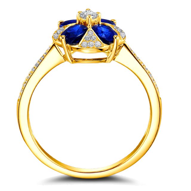 Bague solitaire fleur bleue. Or jaune, saphirs et diamants