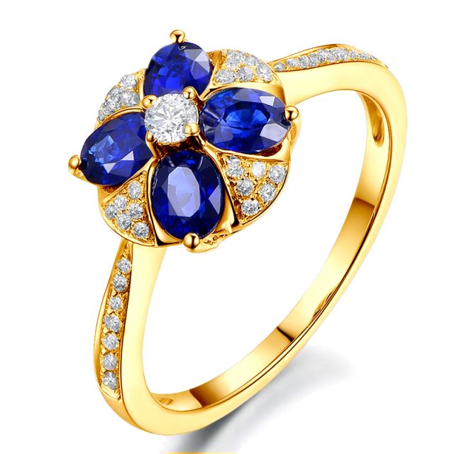 Bague solitaire fleur bleue. Or jaune, saphirs et diamants