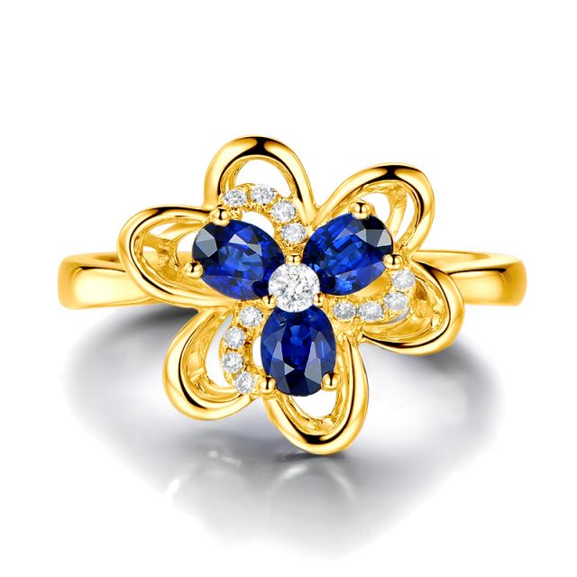 Bague fleur Or jaune fleur anémone. Diamants, saphirs