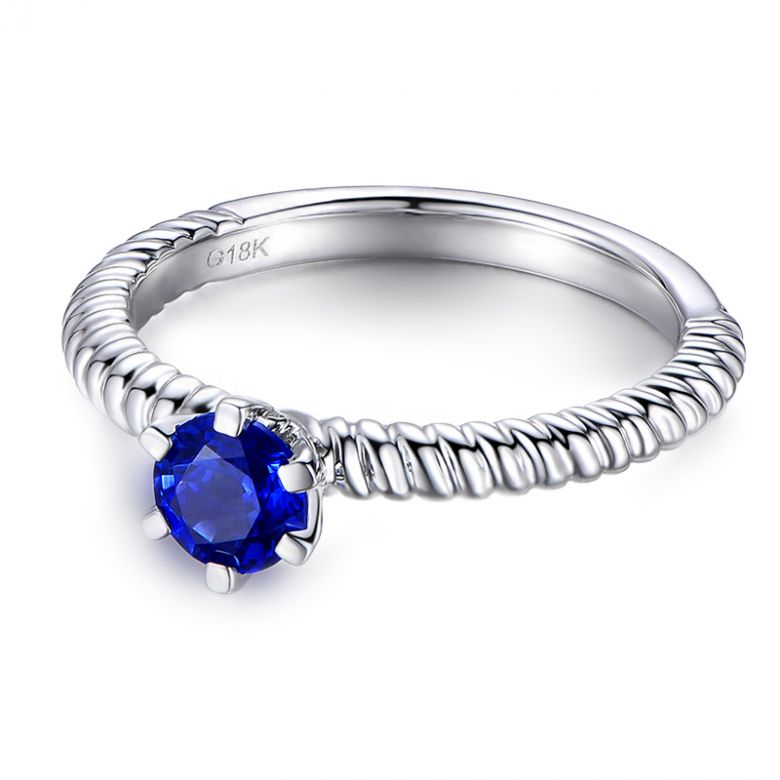 Bague or blanc monture torsadée. Saphir bleu 0.55ct - 6